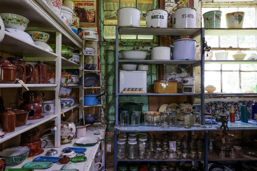 Authentic vintage kitchenware displayed in a rustic, nostalgic shop setting. Ideal for retro themes.