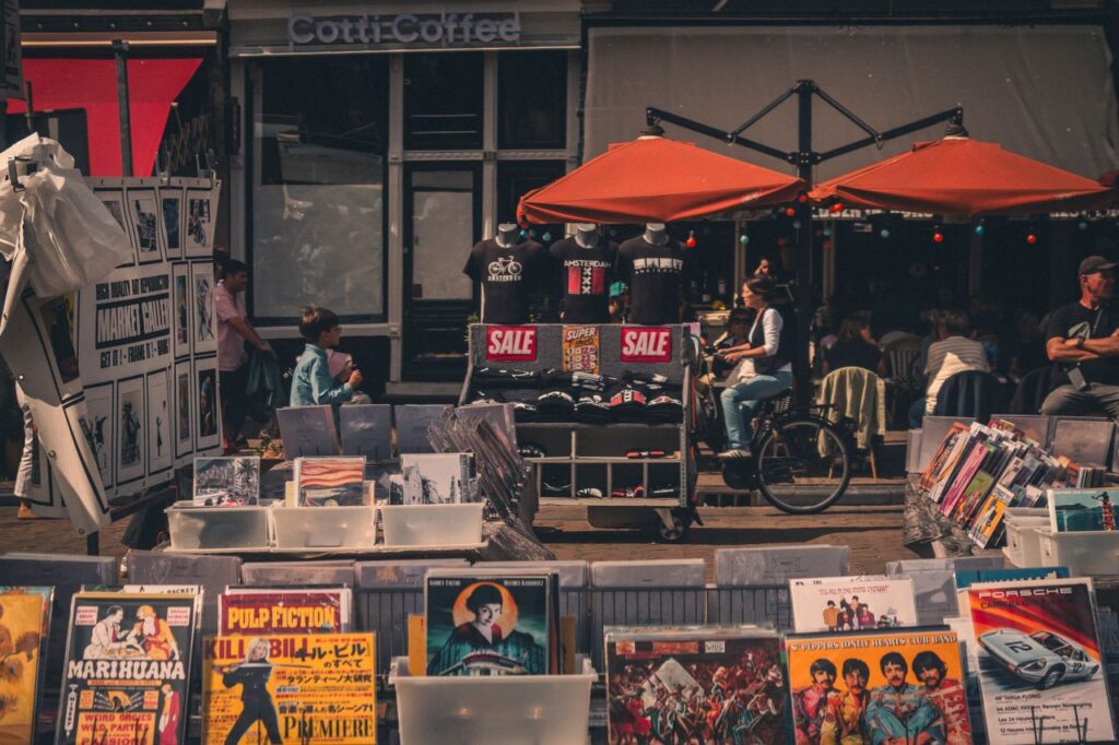 Explore the bustling street market in Amsterdam's Jordaan with vintage records and local vibes.