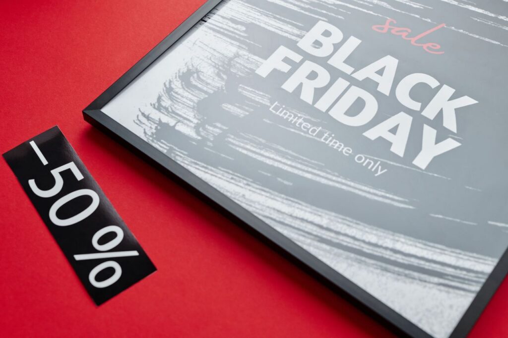 Vibrant Black Friday sale display featuring a bold red background and eye-catching black -50% sign.